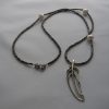 Sterling silver leave pendant, faceted pyrite beads and pearls.