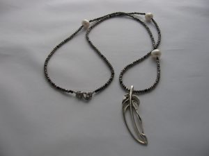 Sterling silver leave pendant, faceted pyrite beads and pearls.