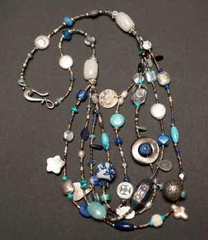 Four strand necklace includes cloisonné, turquoise, amazonite, paua and many other stones and charms.  $170